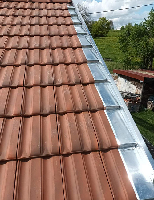 Experts en Travaux de Zinguerie : Installation et Réparation de Gouttières, Lucarnes et Plus dans le Meurthe-et-Moselle (54) et Moselle (57)